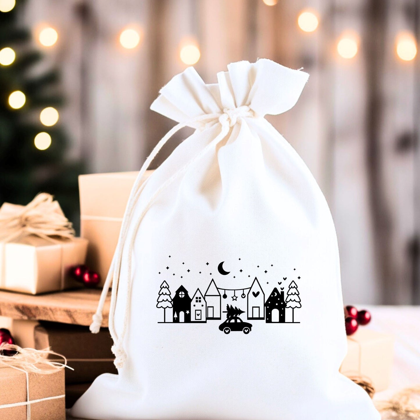 Bügelbild mit weihnachtlichem Häuser-Motiv in Schwarz, hier auf einem Säckchen aufgebügelt