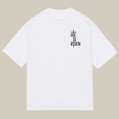 White t-shirt with black 'He is risen' cross design chest print, Christian themed iron-on transfer