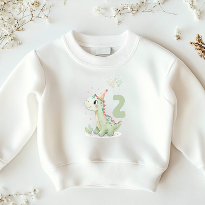 White children's sweatshirt with cute dinosaur print, balloons, party hat, and number 2