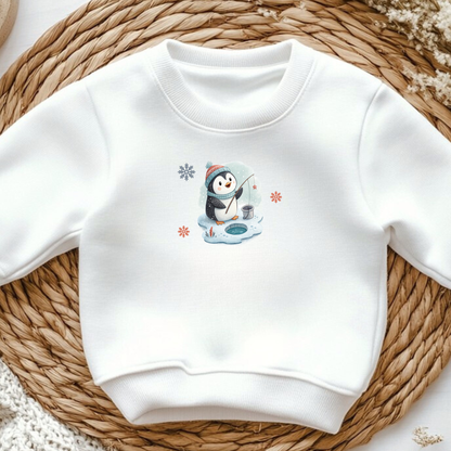White sweatshirt with cute winter penguin ice fishing iron-on design, snowflakes accent