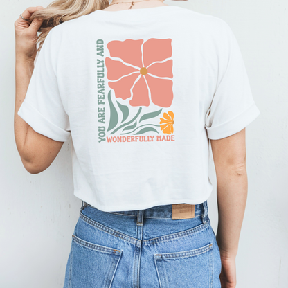 Bügelbild mit Blumen-Design und christlichem Schriftzug, hier als Beispiel auf der Rückseite aufgebügelt