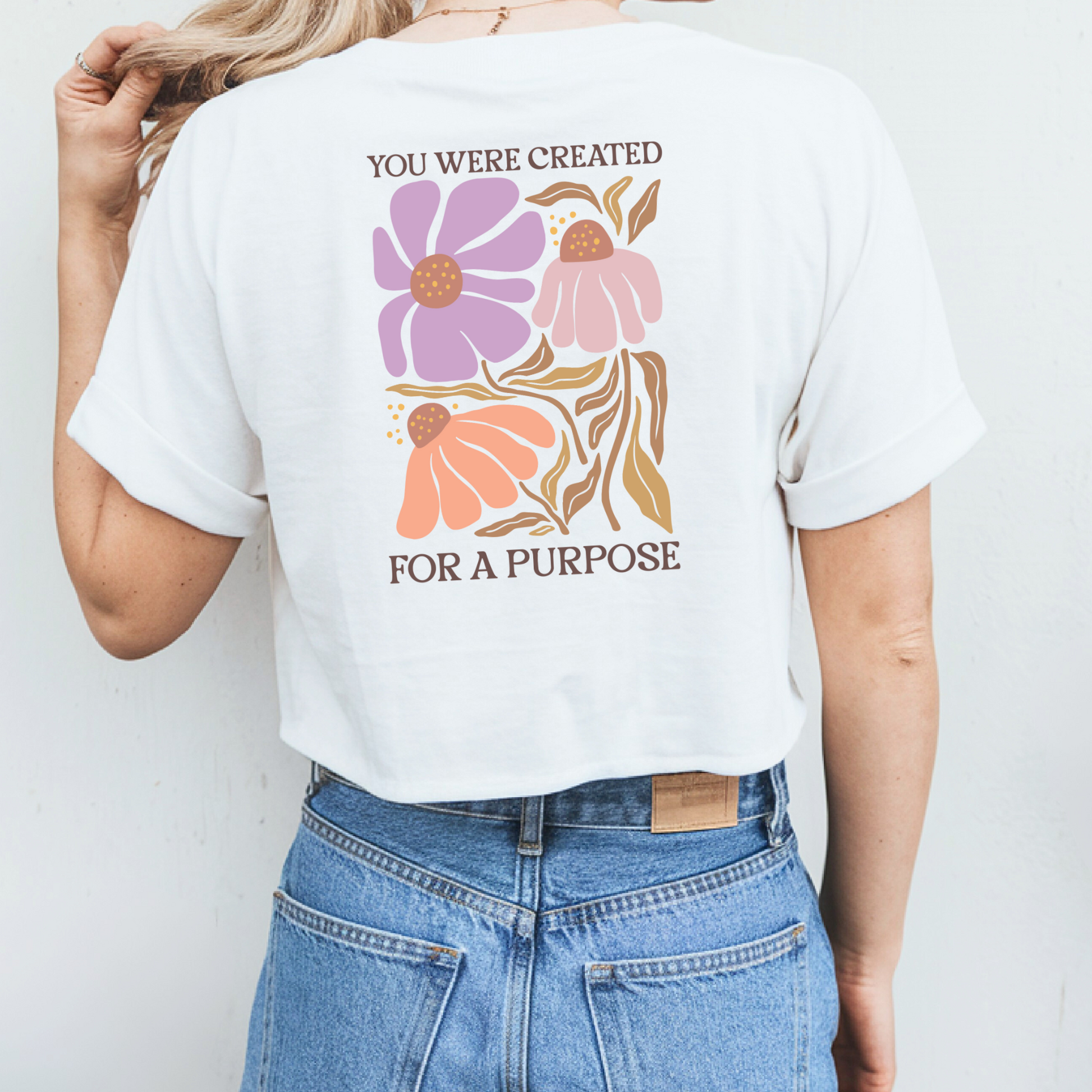 Bügelbild mit Blumen-Motiv und Schriftzug "You Were Created for a Purpose", hier auf der Rückseite aufgebügelt