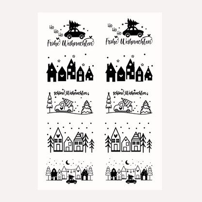 Bügelbild-Set mit weihnachtlichen Motiven wie Häusern, Autos und Schriftzug "Frohe Weihnachten" in Schwarz