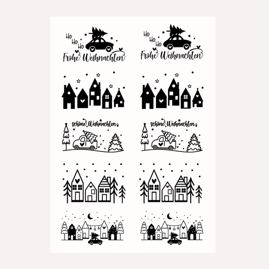 Bügelbild-Set mit weihnachtlichen Motiven wie Häusern, Autos und Schriftzug "Frohe Weihnachten" in Schwarz