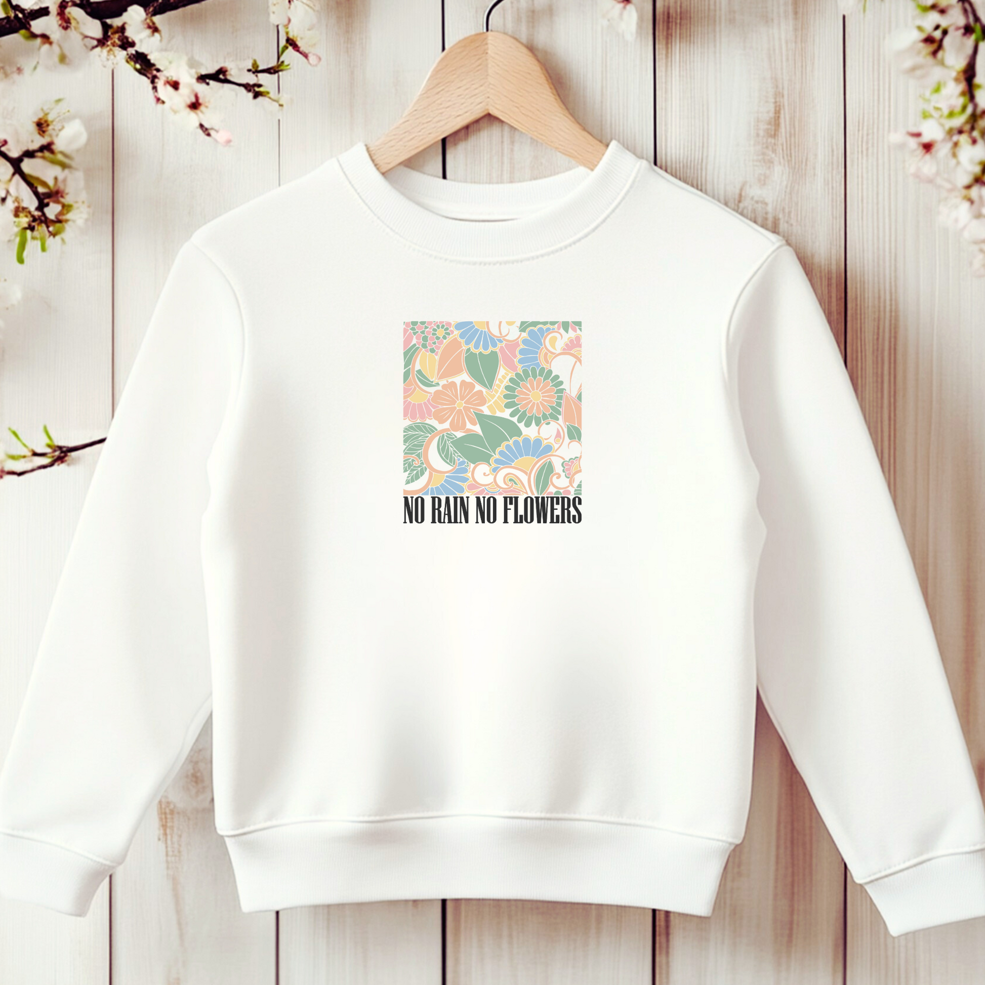 Bügelbild mit floralem Muster und Schriftzug "No Rain No Flowers" zum Aufbügeln